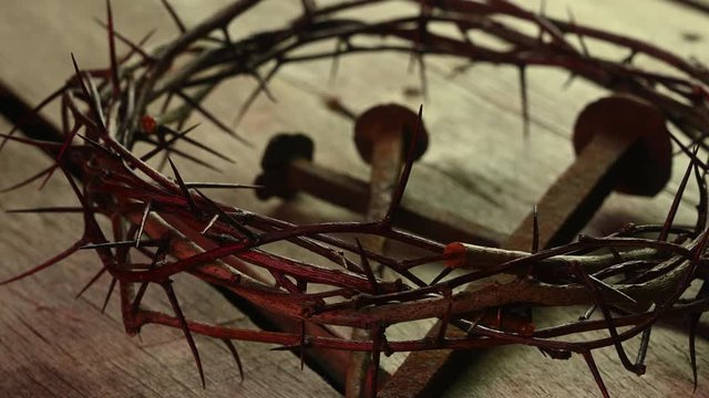 crown of thorns lies on boards with large nails