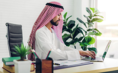 Arabic businessman working with laptop computer.creative arab business people planning at modern...