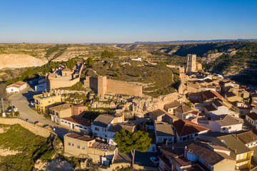 Fototapeta premium Aerial panoramic view of Jorquera town and castle above the Jucar river bend in Albacete province Spain
