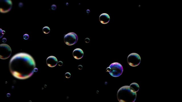 Multicolor bubble soap on black background for screen mode