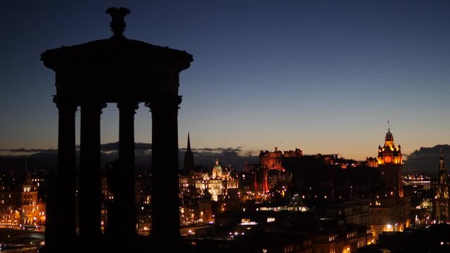 View from Calton Hill in Edinburgh, Scotland at Dusk - Blue hour. Stunning View of cityscape skyline with Castle in the distance. Twilight