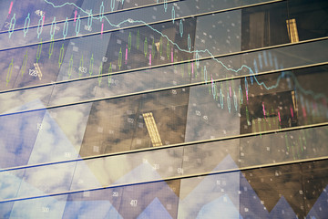 Forex chart on cityscape with tall buildings background multi exposure. Financial research concept.