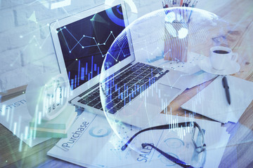 Financial market graph hologram and personal computer on background. Double exposure. Concept of forex.