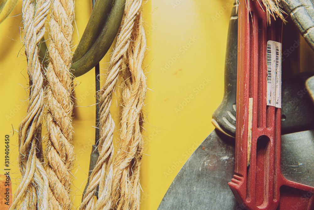 Poster a set of tools on a yellow wall. concept of work in a home workshop, doing homework. tools such as t