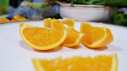 Fototapeta na wymiar slices of orange on a plate