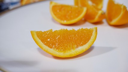 Fototapeta na wymiar slices of orange on a plate