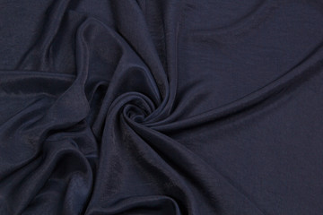 Fototapeta premium The fabric is blue silk. Blue textile drapery