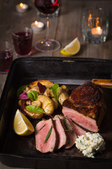 Beef Steak and Side Dish of Baked Potatoes and Mushrooms