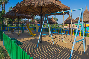 Childrens swings frame in playground area