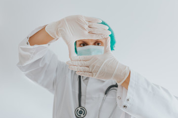 Doctor with medical mask and stethoscope wearing gloves. Novel coronavirus 2019 concept.