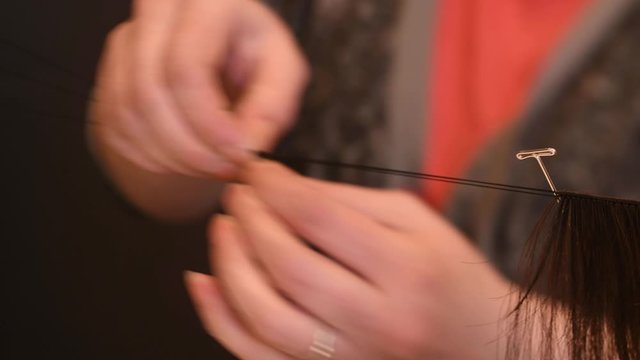 Closeup on process of making wigs