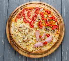 Popular pizza topping in American-style pizzerias on wooden background