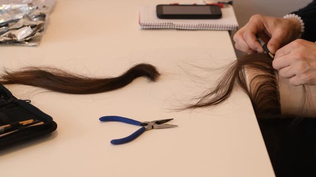 Closeup on process of making wigs