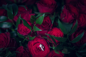 Red roses with diamond ring.