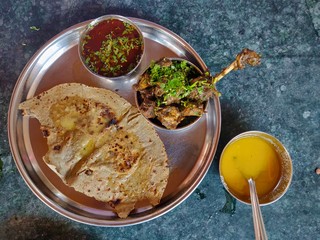 Mutton thali with gravy and roti, India