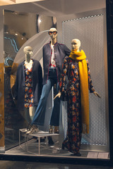 Ashion store in shopping mall, mannequins in a clothing store, winter sale