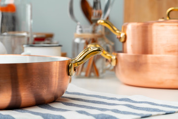 Close up of modern kitchen interior with copper cookware