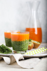 Juice from carrots and spinach with kiwi. Spring and health.