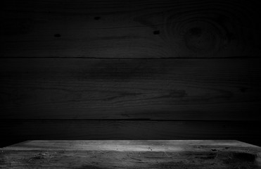 Dark wooden table with a dark smoky blurry background. It can be used to demonstrate or assemble your goods (or products).