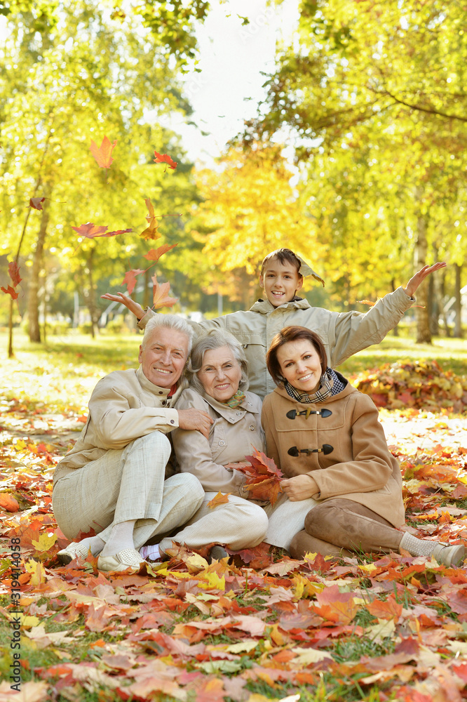 Canvas Prints Portrait of happy family relaxing in autumn forest