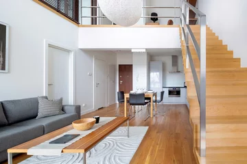Foto op Plexiglas Two-floor open space apartment with wooden stairs and hardwood floor © Dariusz Jarzabek