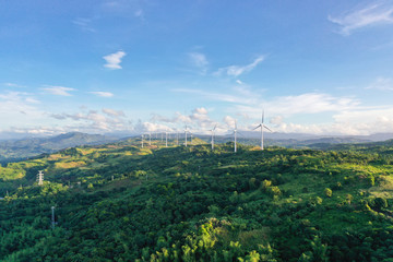 Aerial view of wind turbines and wind mills for electric power production in the Philippines, Luzon.