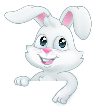 Easter bunny rabbit cartoon character peeking over a sign background and pointing down at it
