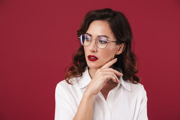 Thinking young beautiful woman posing isolated