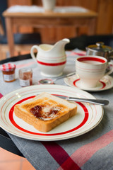 Breakfast with toast, butter and jam