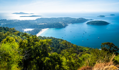 Panorama of the south of the Phuket island with Nai Harn beach and tropical islands, Thailand