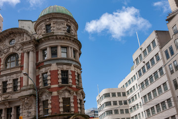 Fototapeta na wymiar Wellington New Zealand. Old Victorian building in contrast with modern architecture buildings.