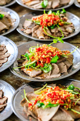 Delicious dried beef slices cold dish,the ingredients are red pepper and garlic with coriander.Chinese food.