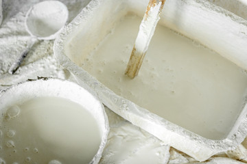 Construction bucket with lime on construction site.