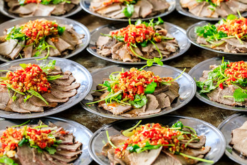 Delicious dried beef slices cold dish,the ingredients are red pepper and garlic with coriander.Chinese food.