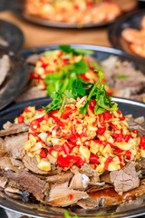 Delicious dried beef slices cold dish,the ingredients are red pepper and garlic with coriander.Chinese food.