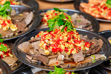 Delicious dried beef slices cold dish,the ingredients are red pepper and garlic with coriander.Chinese food.