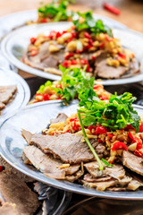Delicious dried beef slices cold dish,the ingredients are red pepper and garlic with coriander.Chinese food.
