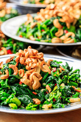 Delicious spinach cold dish,the ingredients are chili and garlic with cashews.Chinese food.
