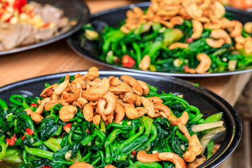 Delicious spinach cold dish,the ingredients are chili and garlic with cashews.Chinese food.