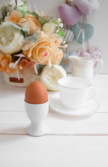 boiled egg for breakfast in a light key with a bouquet