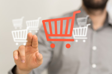 Businessman pressing modern technology panel shopping cart web phone credit card.