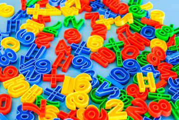 Multicolored plastic figures, educational skills supplement for kindergarten and preschool children.