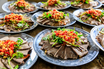 Delicious dried beef slices cold dish,the ingredients are red pepper and garlic with coriander.Chinese food.