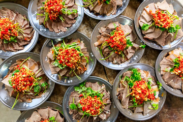 Delicious dried beef slices cold dish,the ingredients are red pepper and garlic with coriander.Chinese food.