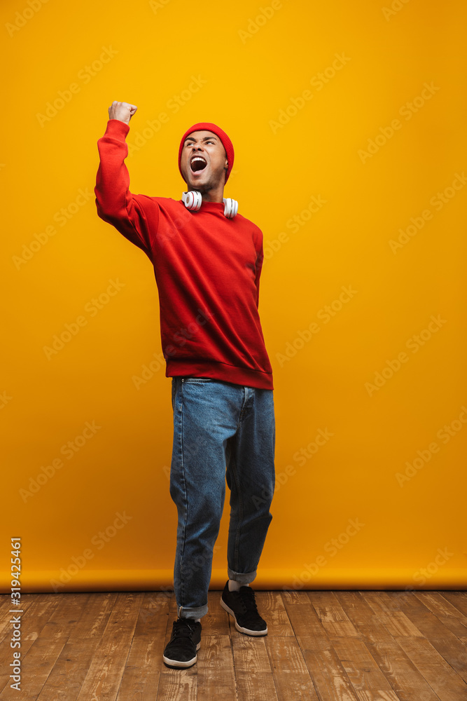 Wall mural Portrait of an attractive confident casual young man