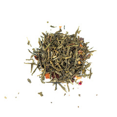 pile of natural green tea mix contains cherry berries, rose hip, jasmine flowers, rose petals