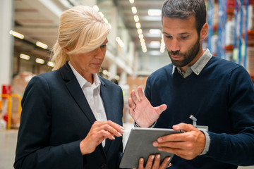 Managers in Warehouse discuss about business strategy