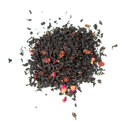 pile of natural black tea mix contains barberry and goji berries, pomegranate petals