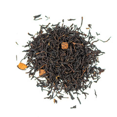 pile of natural black tea mix with caramel isolated on white background