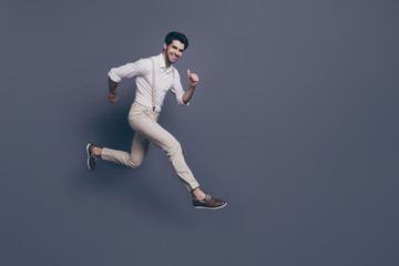 Fototapeta na wymiar Full body photo of cheerful charismatic guy hear black friday news jump run after discounts wear good looking outfit isolated over grey color background